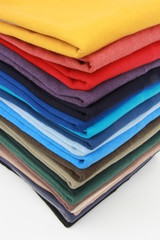 many colorful sweaters in a row..Still life of clothes, stack of sweater