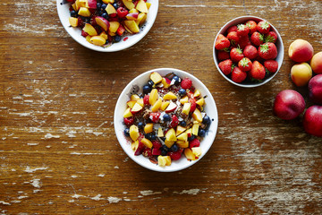 bowls of heathy organic muesli with fruits on wooden table helathy lifestyle