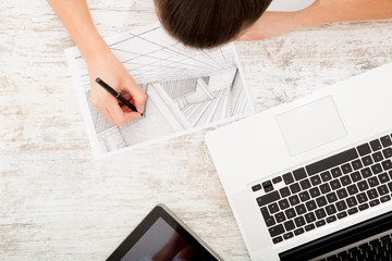 Woman drawing a blueprint