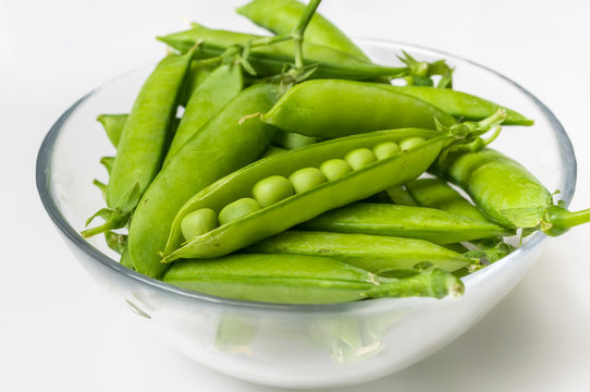 Fresh green peas in bowl