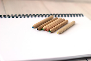 Color pencils on sketchbook, concept of drawing, close up