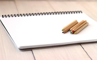 Color pencils on sketchbook, concept of drawing, close up