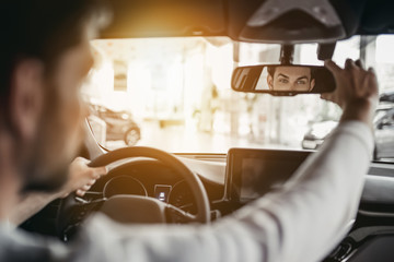 Man in car dealership