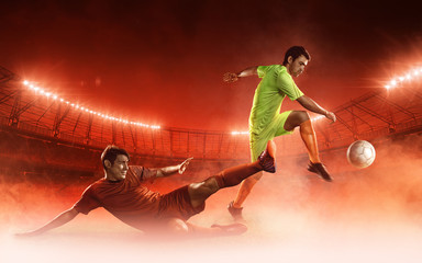 two soccer players on a soccer stadium fighting for a ball on dramatic red steam background