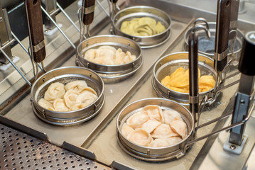 Machine for cooking dumplings