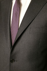 close up of man in a suit with tie and handkerchief