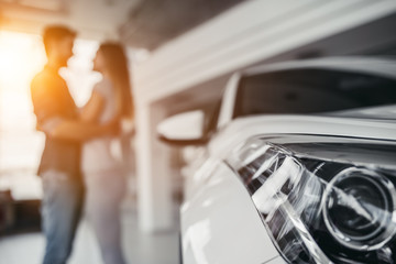 Couple at car dealership