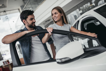 Couple at car dealership