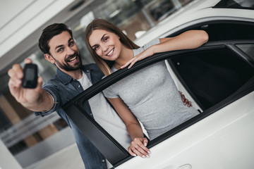 Couple at car dealership