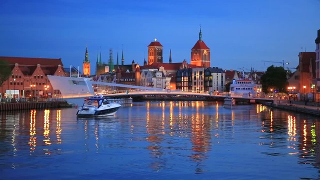 Old town in Gdansk and catwalk over Motlawa river at night, Poland