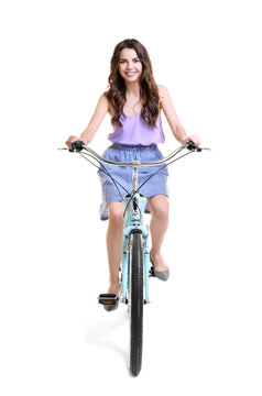 Beautiful Young Woman Riding Bicycle On White Background