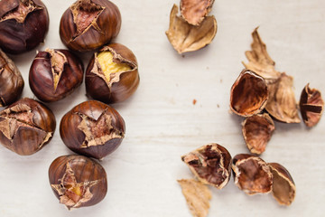 Roasted chestnuts on wooden background