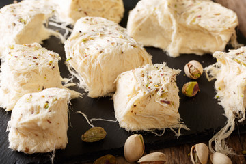 Delicious sweetness fresh dessert pismaniye with nuts pistachios macro. Horizontal