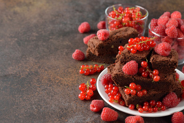 Chocolate brownies with raspberries and currants