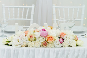 table set for wedding dinner decorated with flowers