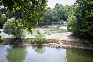 Munich, summer view of Isar river and Praterinsel island from the city promenade