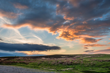 Naklejka premium Sunset over Lordenshaws Hillfort / Lordenshaws Hillfort at the foot of the Simonside hills near Rothbury, in the Northumberland National Park, is popular with walkers