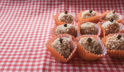 Brazilian dessert sweet of pumpkin, coconut and cinnamon. Festa Junina Party Brazilian Culture Concept Image.