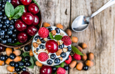 Naklejka na ściany i meble Healthy yogurt with fruits or sundae ice cream in a cup, summer dessert concept