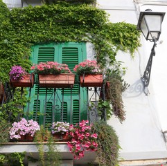 Typical South Italian balcony with antique latern of a residential home in Bari, Italy