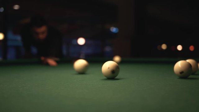 Concentrated Man Aiming to Take a Shot Billiard Ball. Snooker Game Background.