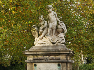 Old sculpture in Brussels park. Belgium