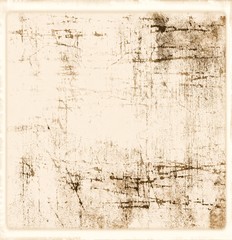 Grunge scratched texture background in sepia tones.