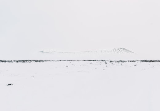 Hverfjall volcano covered in snowy shades of white, myvatn area, Iceland. Vertical photo