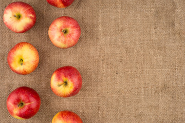 Red apple on sackcloth.