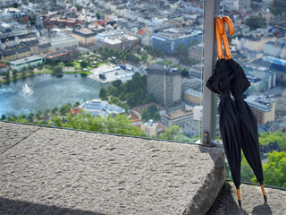 Two lonely umbrellas at the observation desk above Bergen, Norway