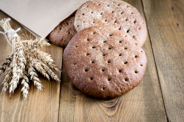 Freshly baked rye bread on wooden table Homemade bread