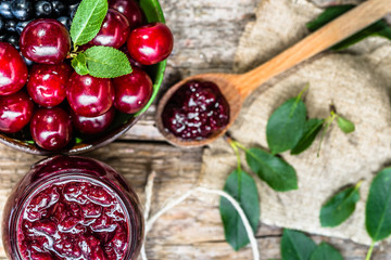 Sweet cherry confiture, preserves in glass jar made in autumn for winter