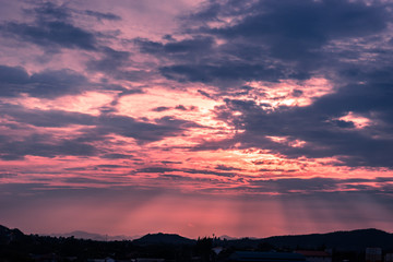 sun beam shine thru cloud to ground in evening