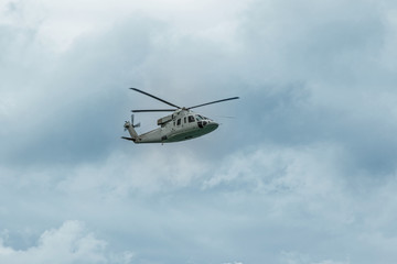 Fototapeta na wymiar Military navy helicopter in the sky