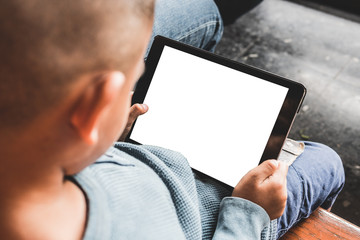 young boy playing tablet,blank screen tablet holding by hand,selective focus and vintage tone