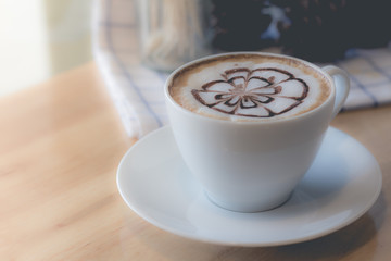 hot coffee with foam milk art in afternoon break