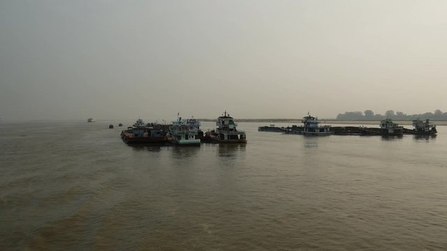 Cargo ships at the Ayeyarwady river, Myanmar, Burma