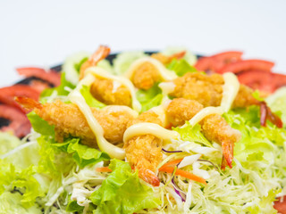 Shrimp Fried on Vegetable Salad in Black Plate.