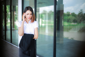Fototapeta premium Modern business women casual outfits in the office with copy space, Business woman standing cross one's arm, Asian people young beautiful businesswoman smile. business concept