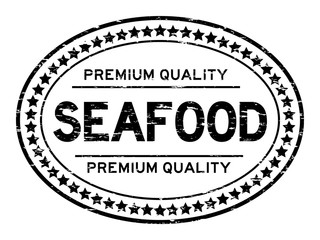 Grunge black premium quality seafood oval rubber seal stamp on white background