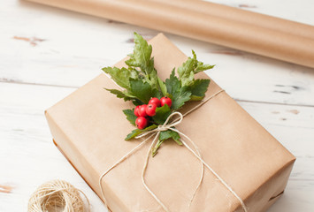 Packed for gift giving in a simple paper with twig and red berries