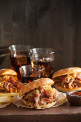 homemade pulled pork burger with caramelized onion and bbq sauce