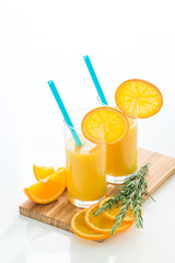 Fresh orange juice on white table