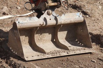 Bagger mit Baagerschaufel auf einer Baustelle