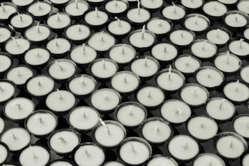 abstract background of the arrayed oil lamps , concept of discipline on black and white tone