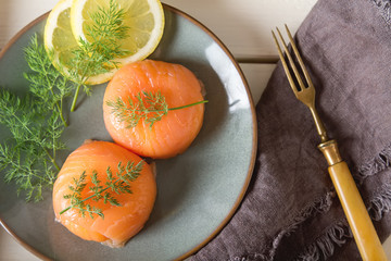 Smoked salmon, mousse, pate with dill and lemon. Light white bac