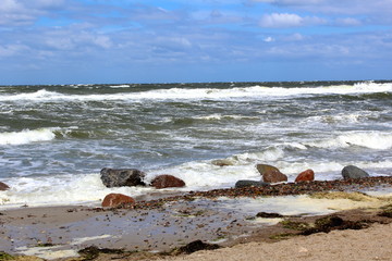 Fototapeta na wymiar baltic sea beach in stormy weather with sea waves