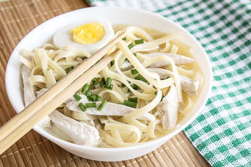 Delicious noodles in chicken broth. Japanese noodle soup Udon. Healthy food concept