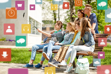 happy teenage students taking selfie by smartphone