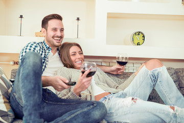 Young couple on the sofa in love